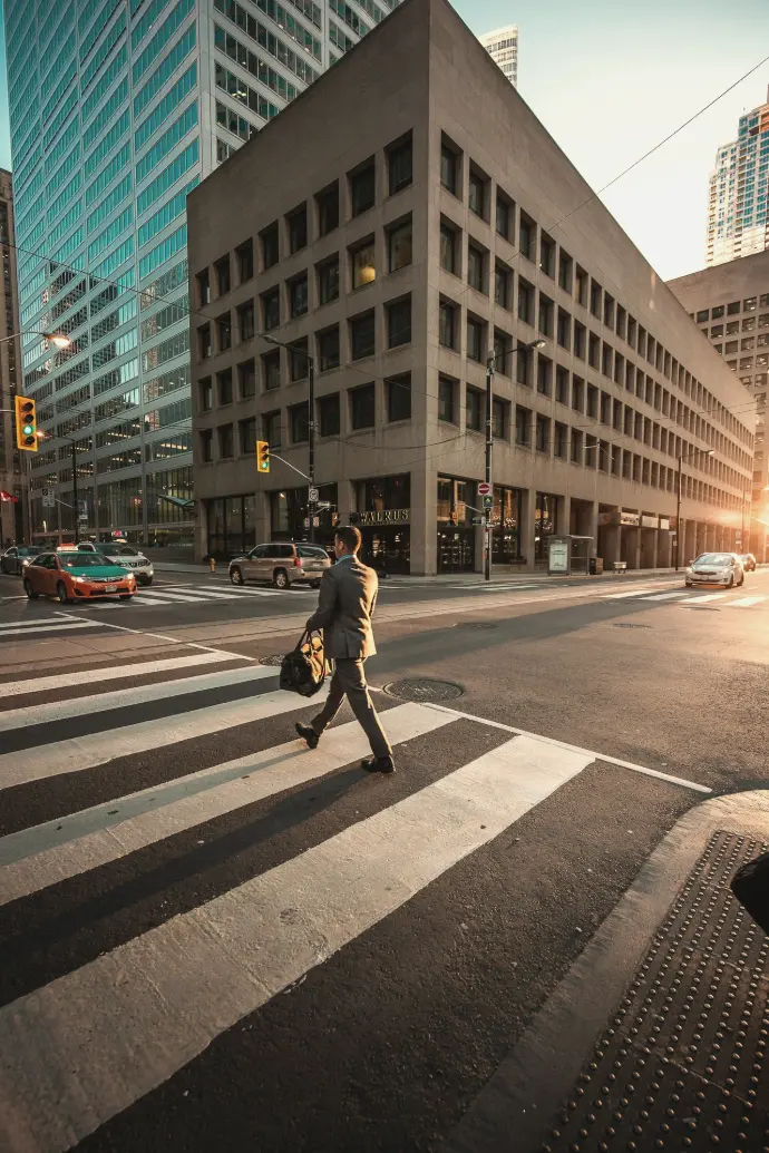 man crossing pedestrian lane